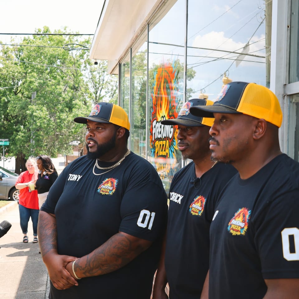 The Fire King team being interviewed by WIS and WLTX news at the grand opening.