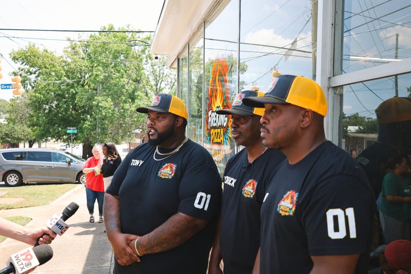 The Fire King team being interviewed by WIS and WLTX news at the grand opening.
